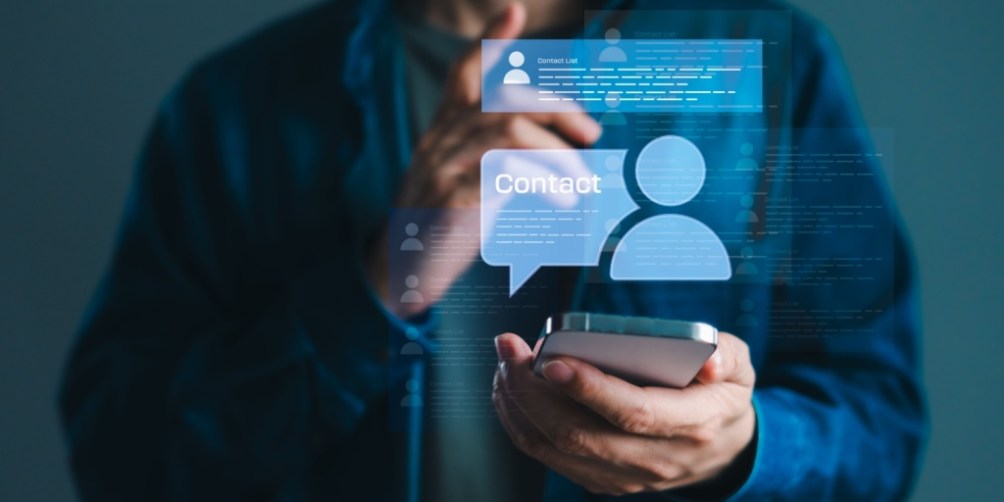 Person using a smartphone with digital contact icons displayed, illustrating how to organize and access an emergency contact list on a mobile device.