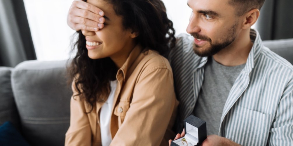 Man surprising his partner with an engagement ring, emphasizing why renters insurance coverage for jewelry is essential for protecting high-value pieces.