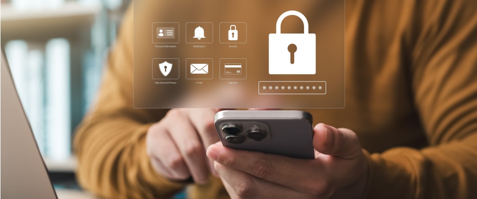 Person using a smartphone with a digital security lock icon overlay, representing data protection, passwords, and cybersecurity, illustrating how to stay safe online.