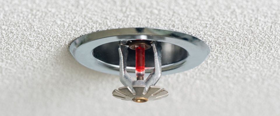 Ceiling fire sprinkler, illustrating that renters insurance often covers your belongings when the building’s fire suppression system goes off and your property gets damaged.